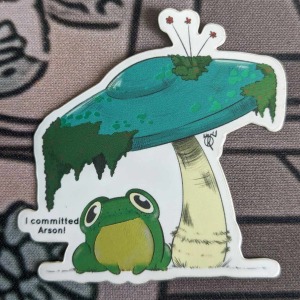 Autocollant grenouille sous un champignon